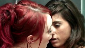 Redhead and brunette take turns licking wet in the shower